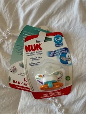 NUK Silicone Orthodontic Pacifier in White with Orange & Teal Accents (0-6m)